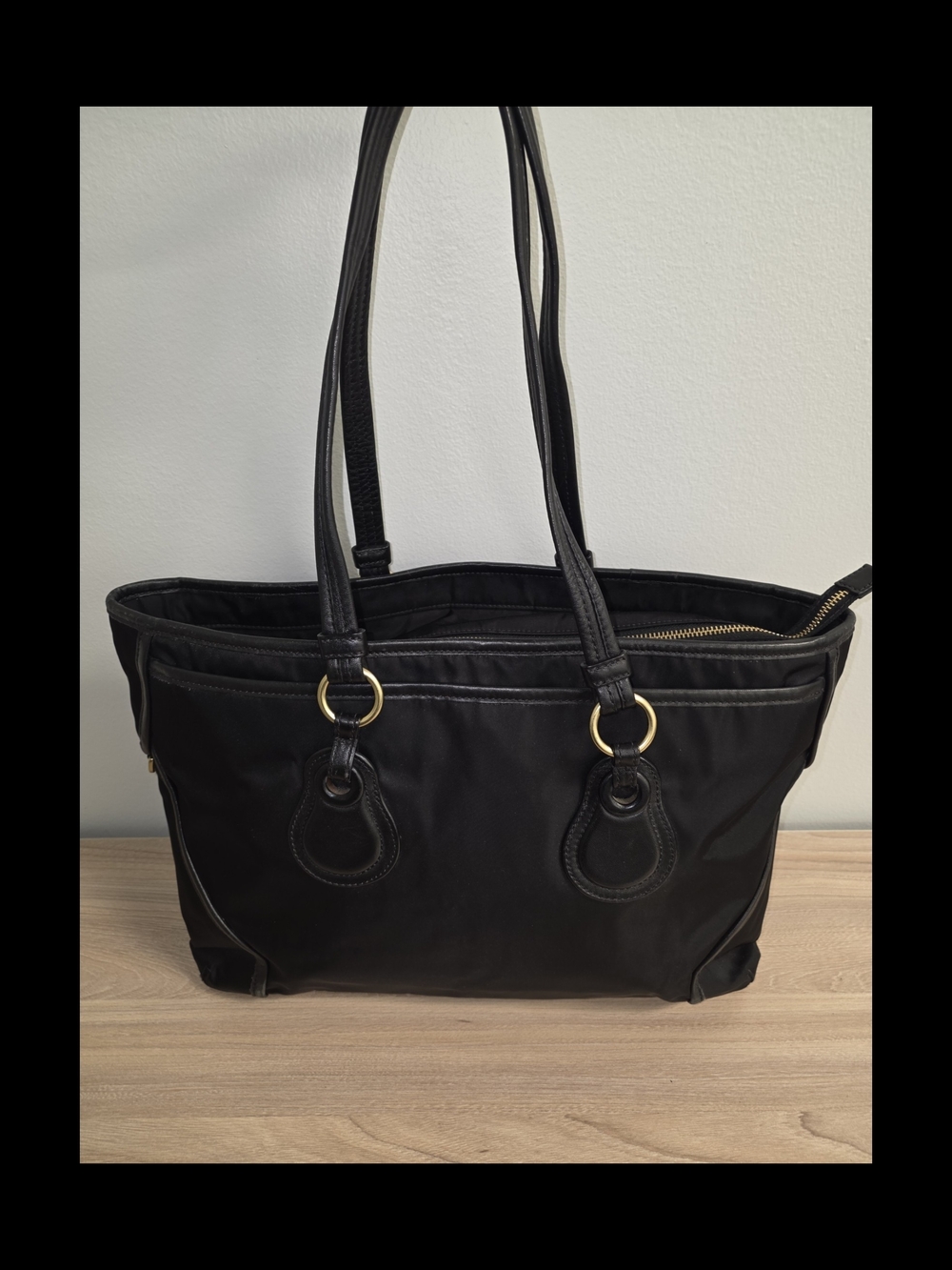 Tumi Black Tote with Gold Ring Accents